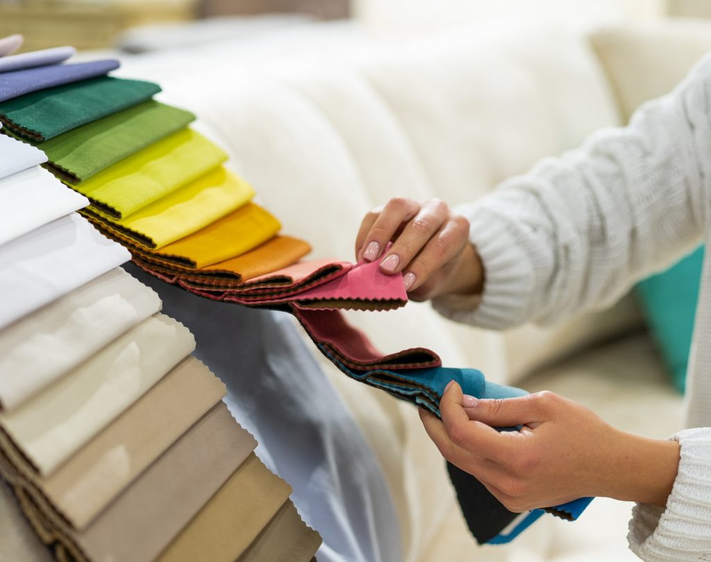 the-woman-chooses-the-fabric-on-the-sofa-textile-industry-background-tissue-catalog.jpg the-woman-chooses-the-fabric-on-the-sofa-textile-industry-background-tissue-catalog.jpg